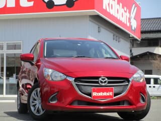 マツダの デミオの中古車 with 5 seats and color ソウルレッドプレミアムメタリック